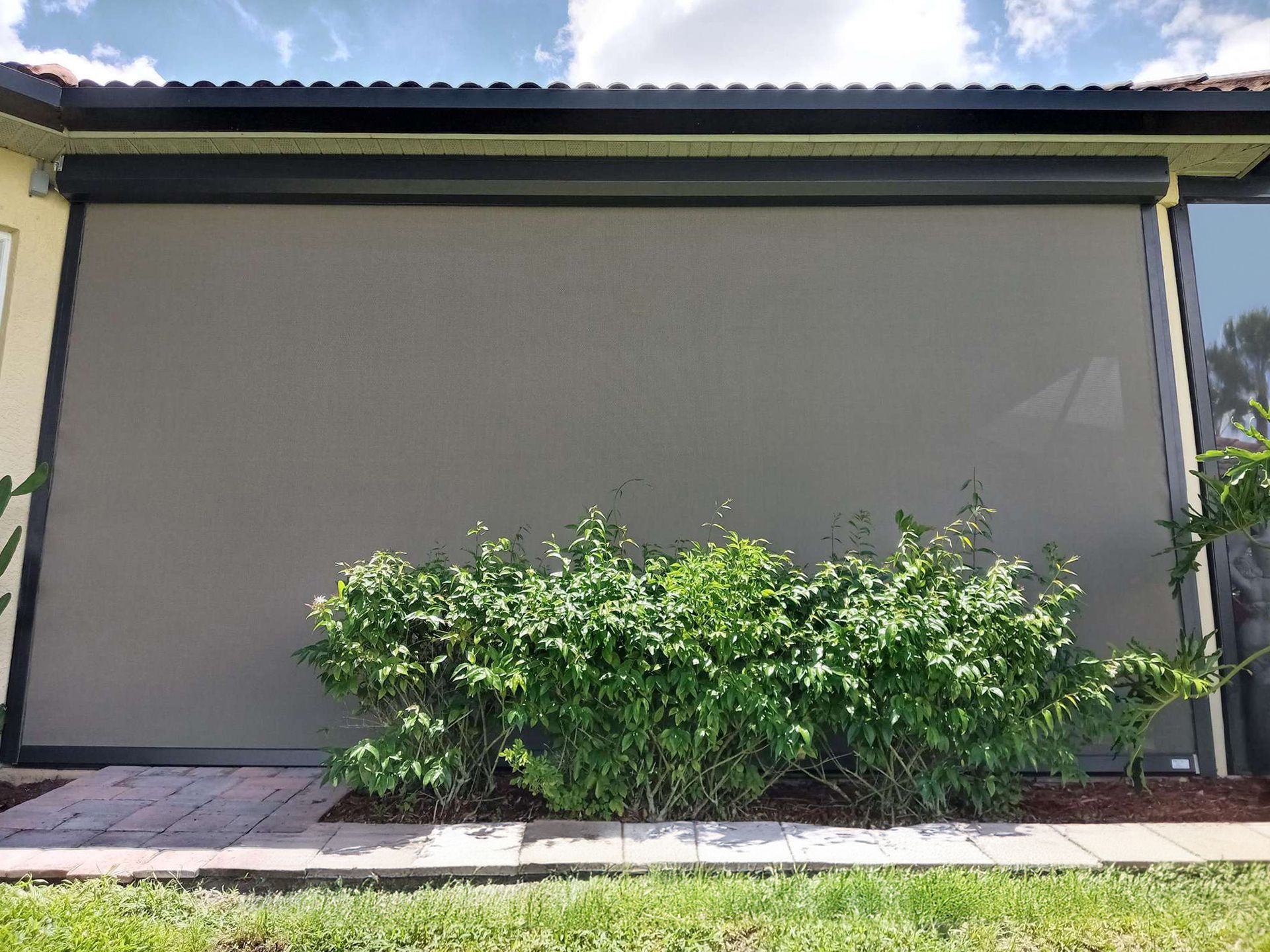 A house with a screen on the side of it