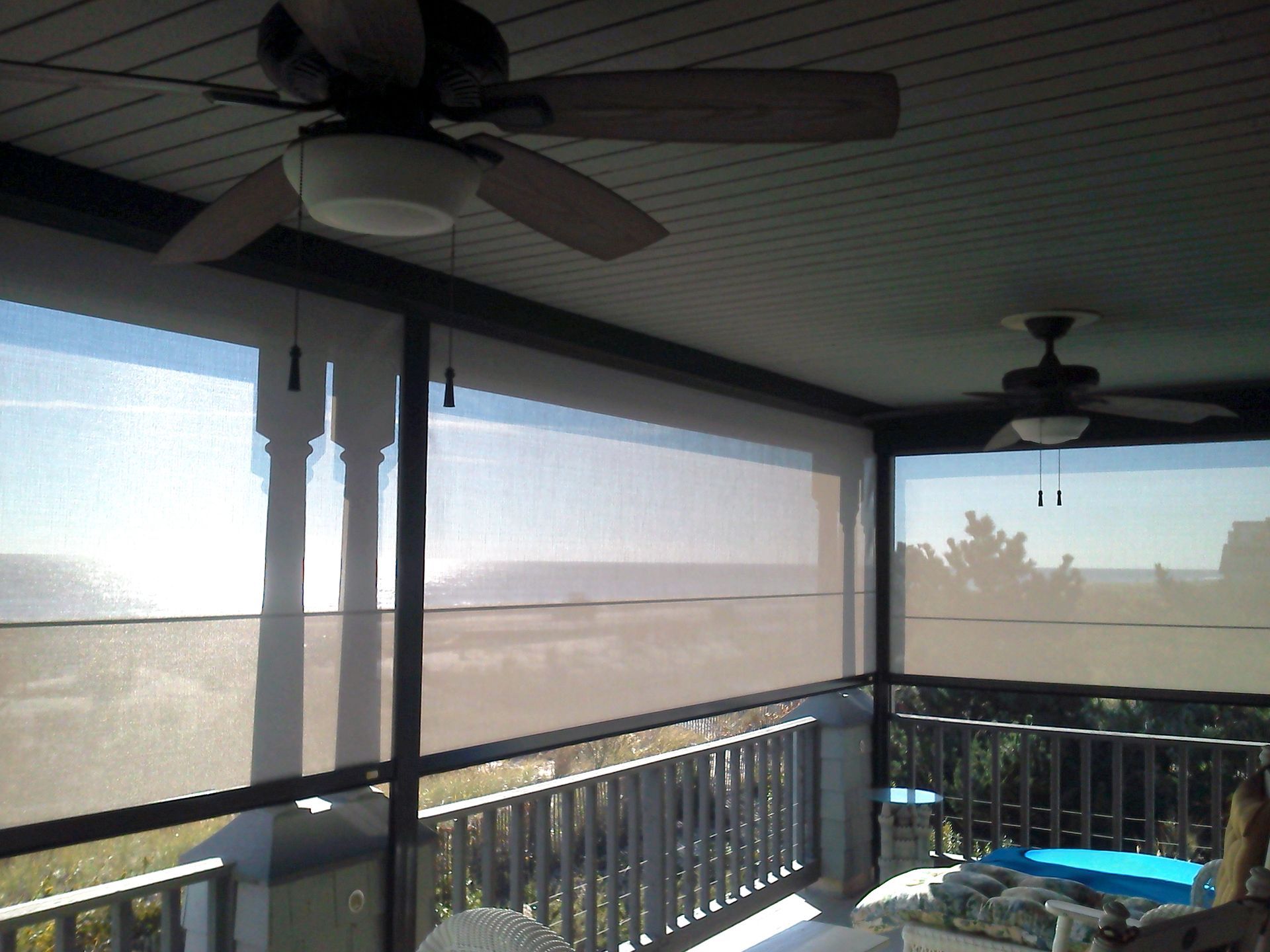 A patio with a rolling screen