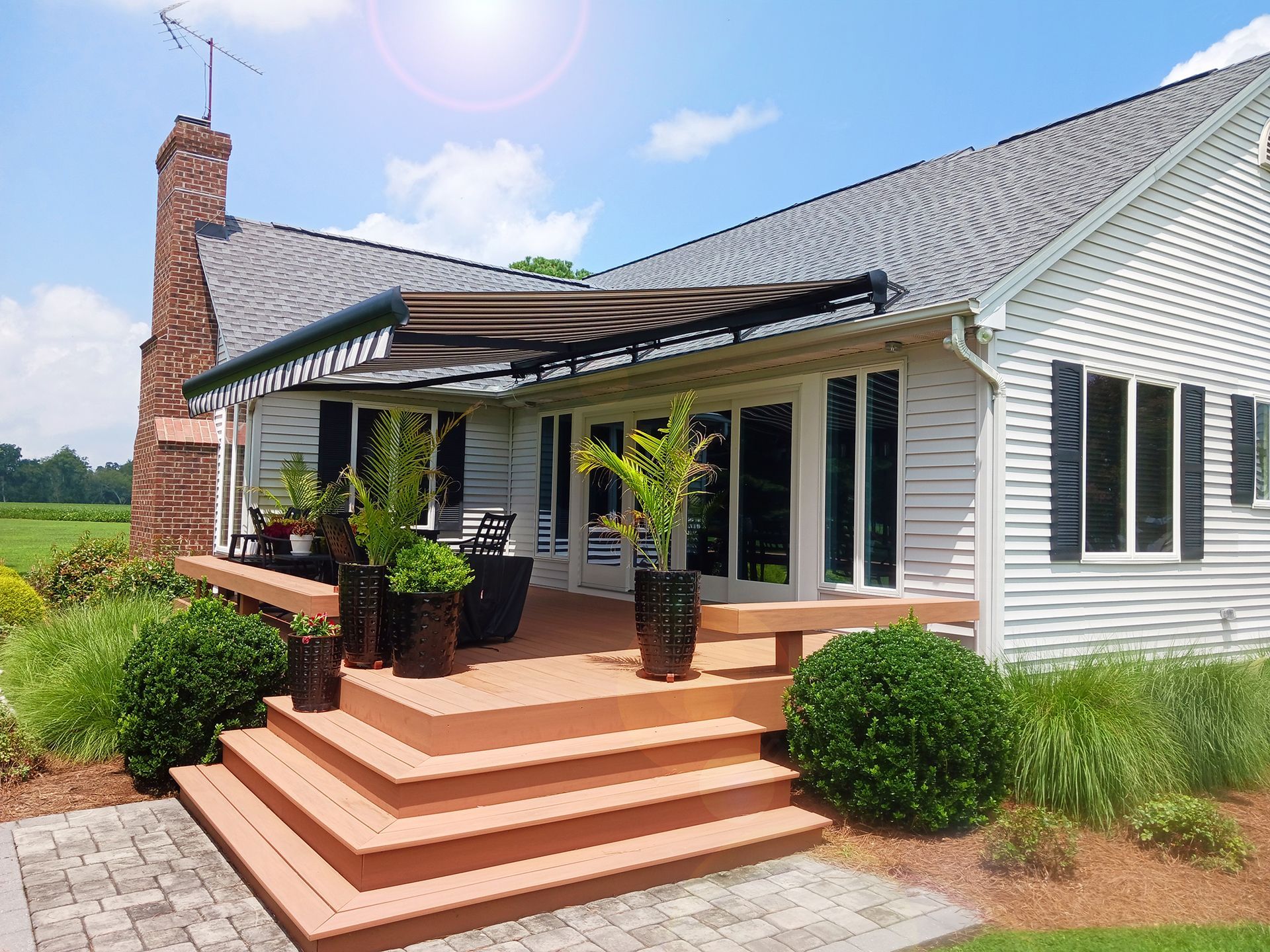 House with a large deck and stairs
