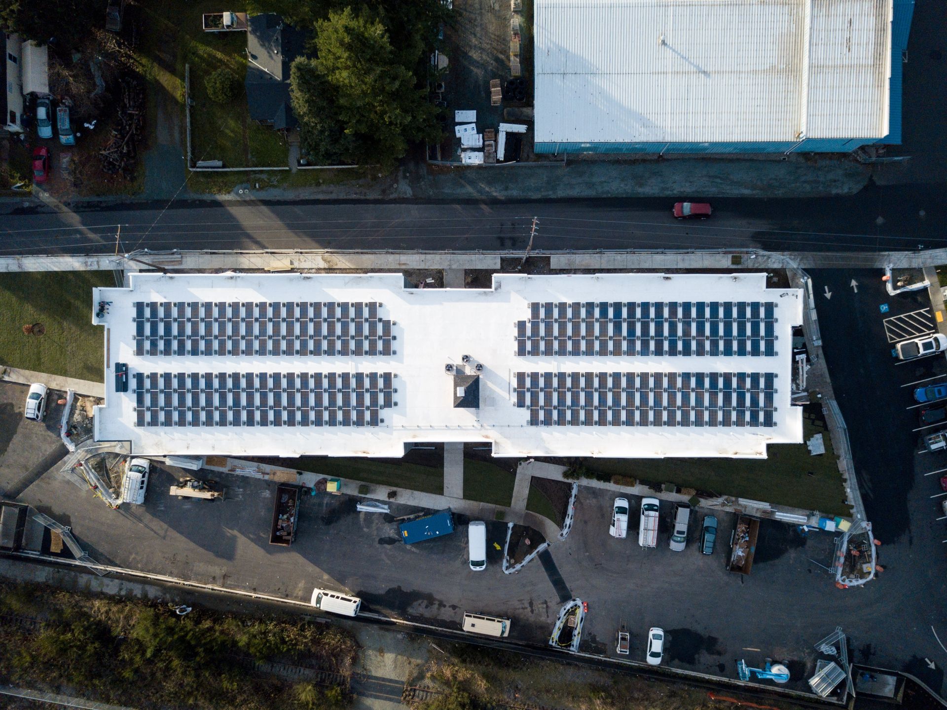 top view of a building with solar panels on the roof