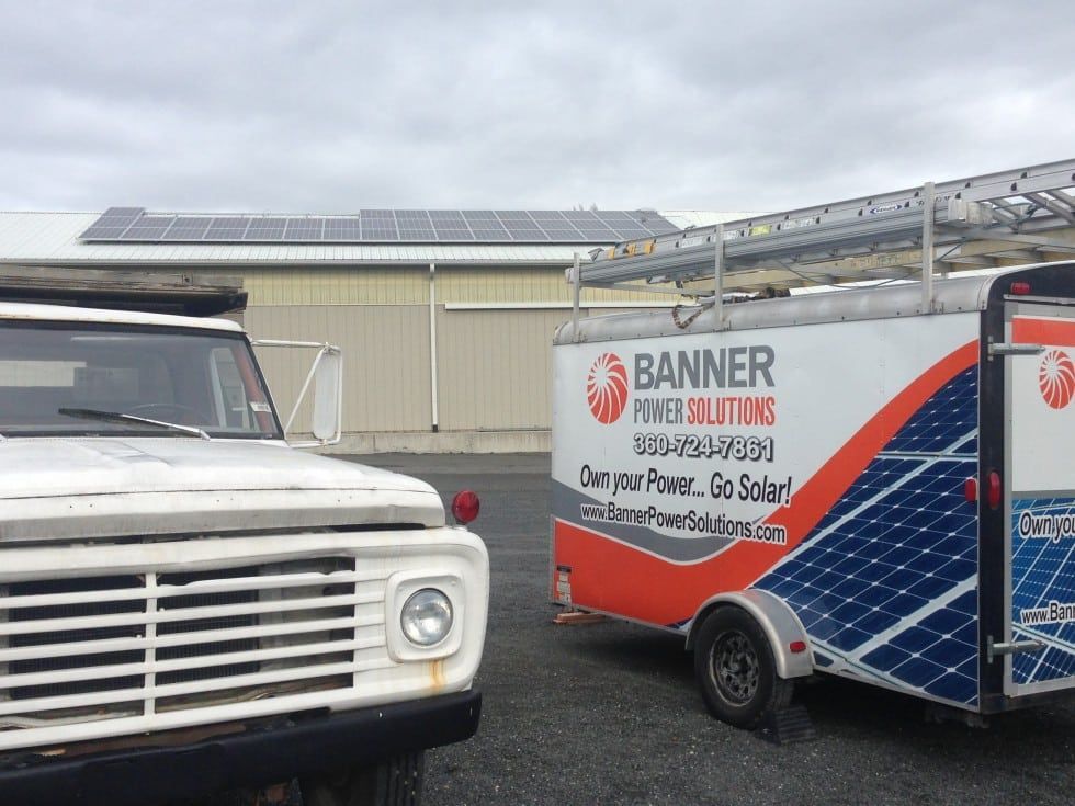 a banner power solutions trailer is parked next to a truck
