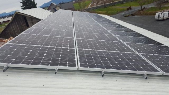 a roof with a lot of solar panels on it