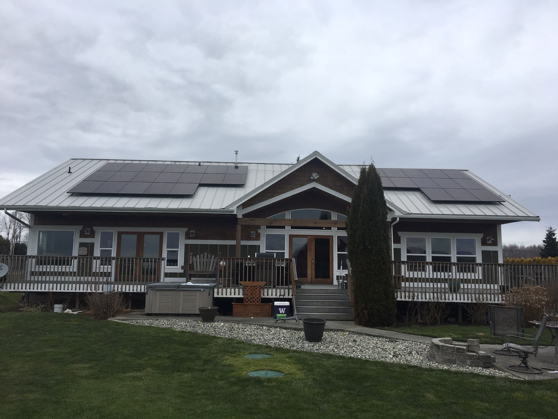 a large house with solar panels on the roof