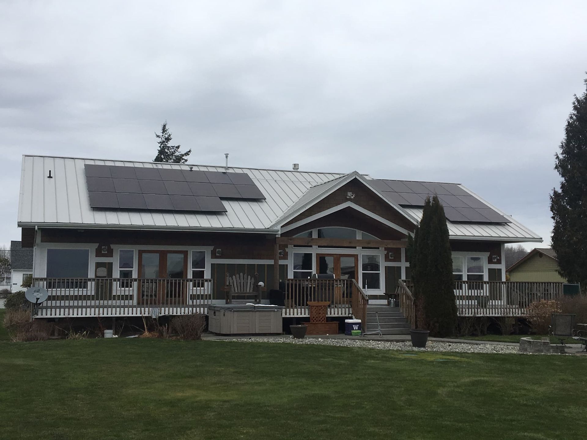 a large house with solar panels on the roof