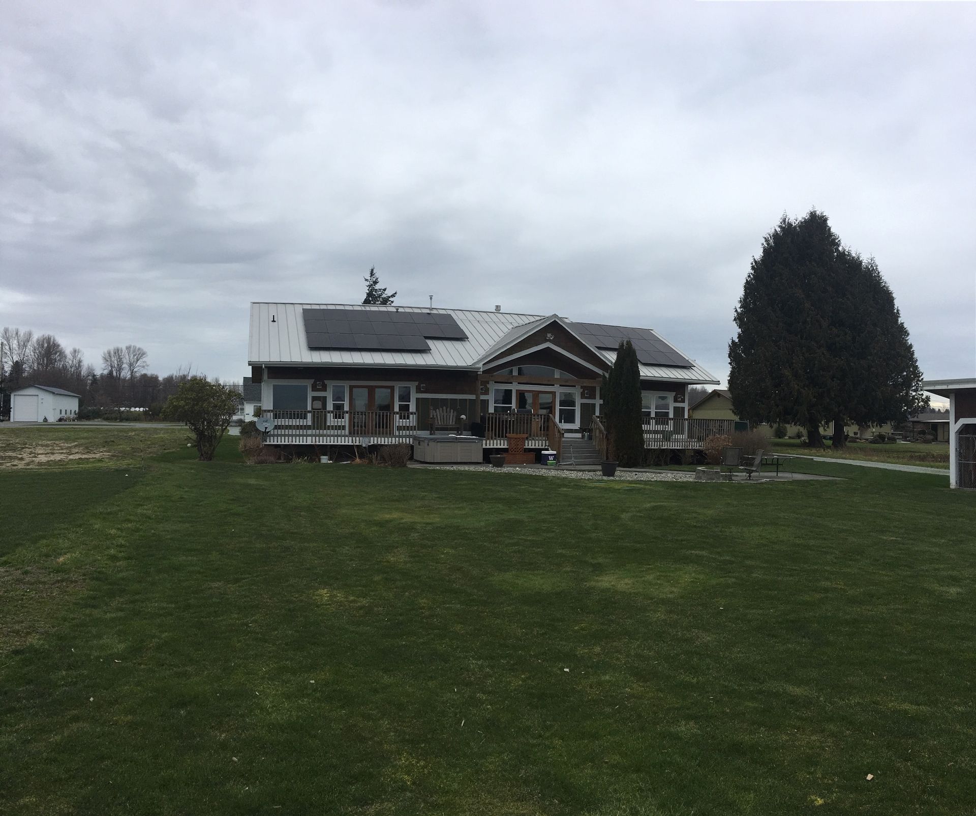 a large house with solar panels on the roof