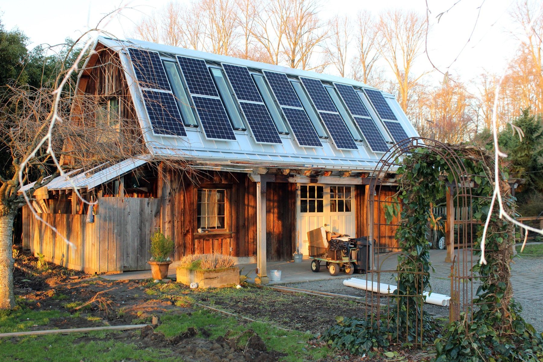 a wooden house with solar panels on the roof
