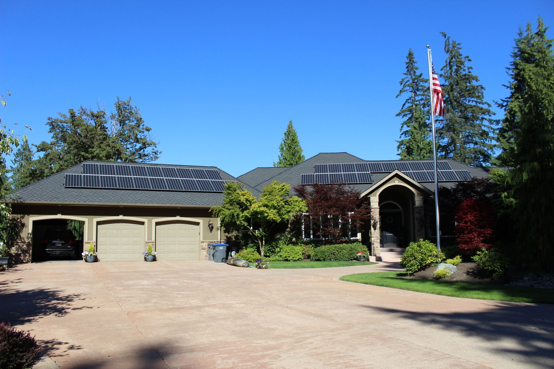 a large house with solar panels on the roof