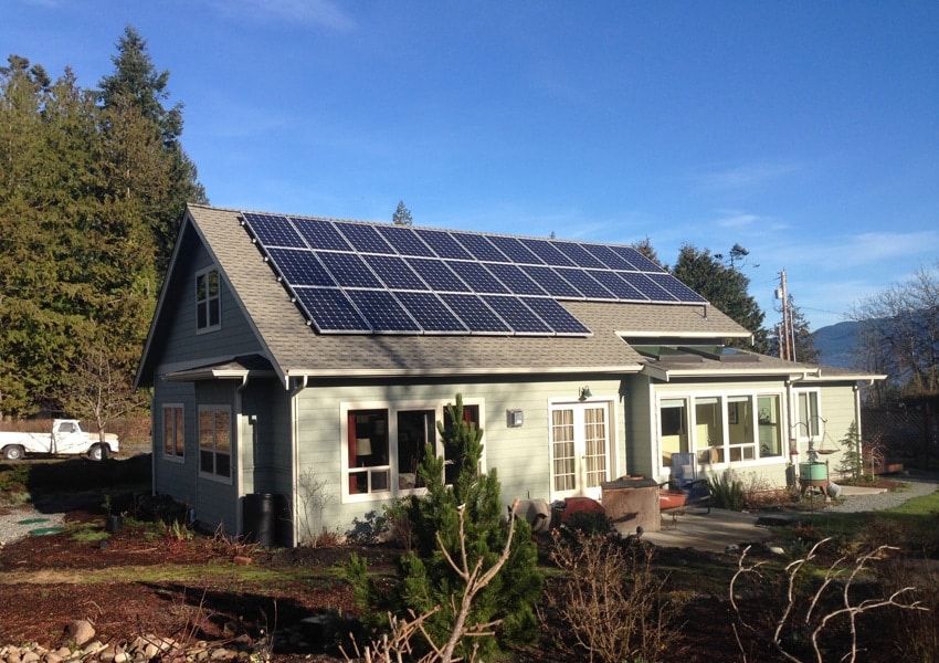 a house with a lot of solar panels on the roof