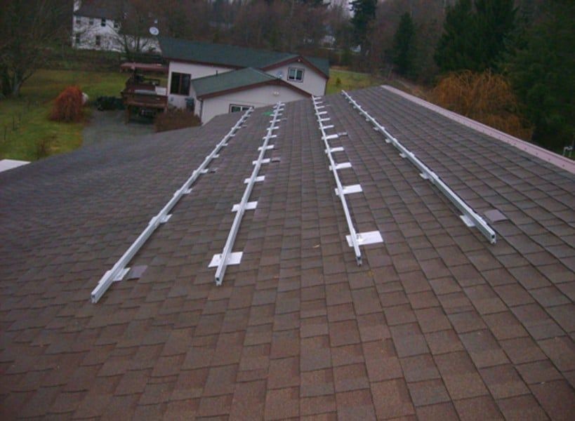 a roof with a row of solar panels on it