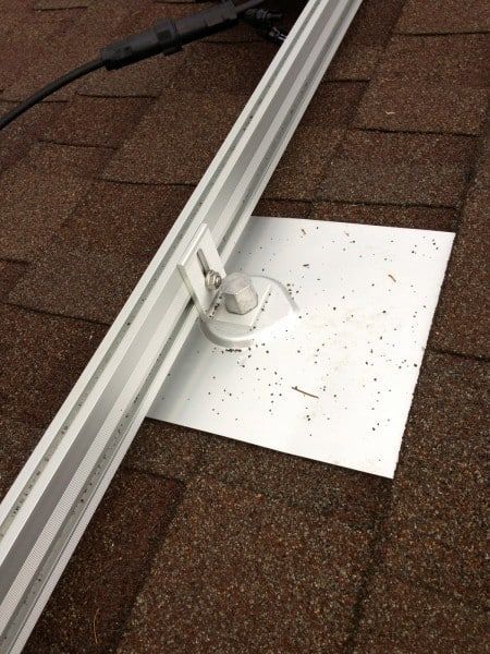 a piece of metal is sitting on top of a brick roof