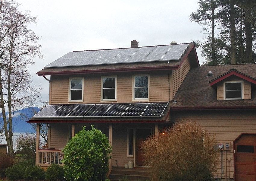 a house with a lot of solar panels on the roof