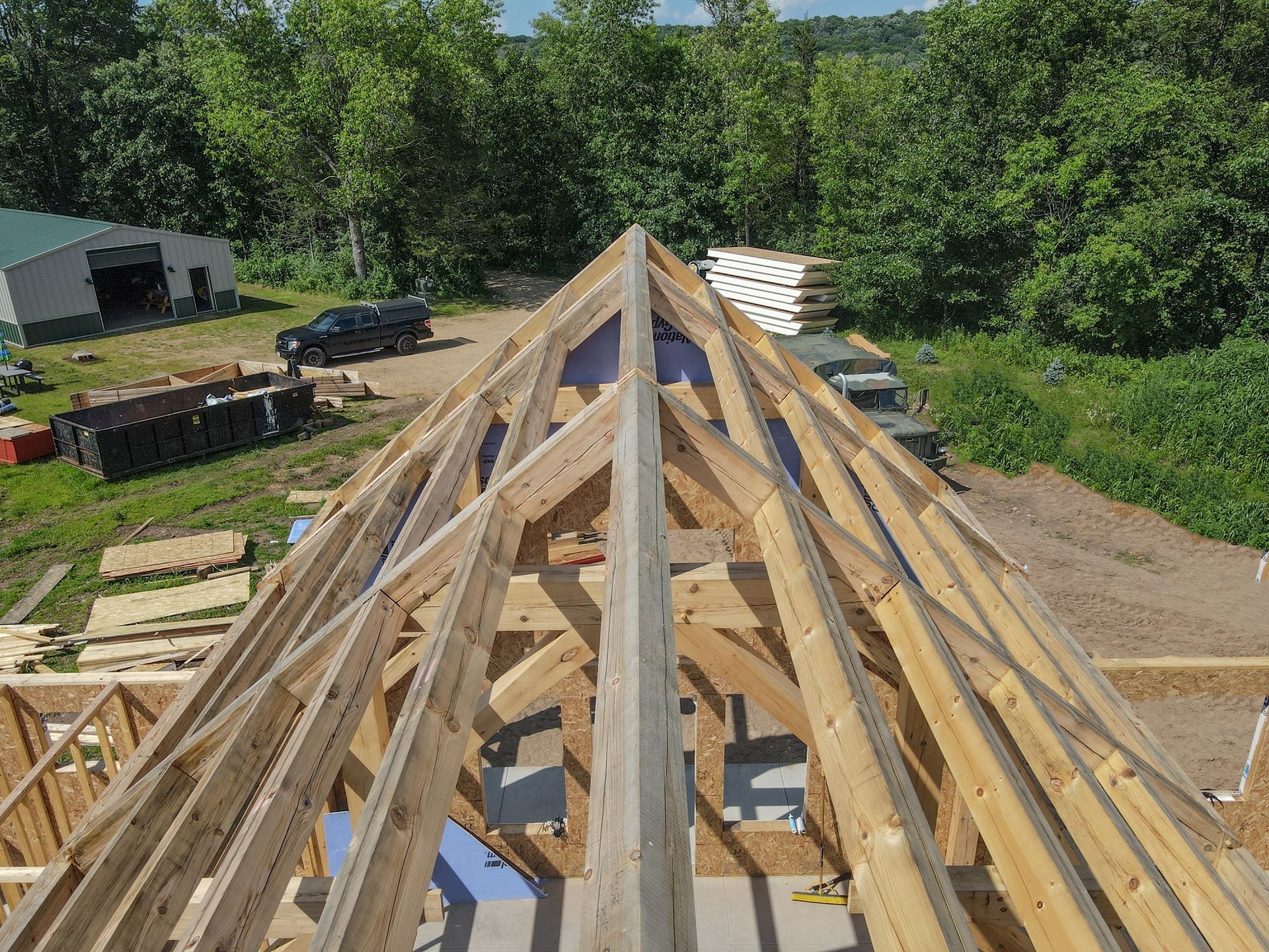 An aerial view of a wooden roof under construction