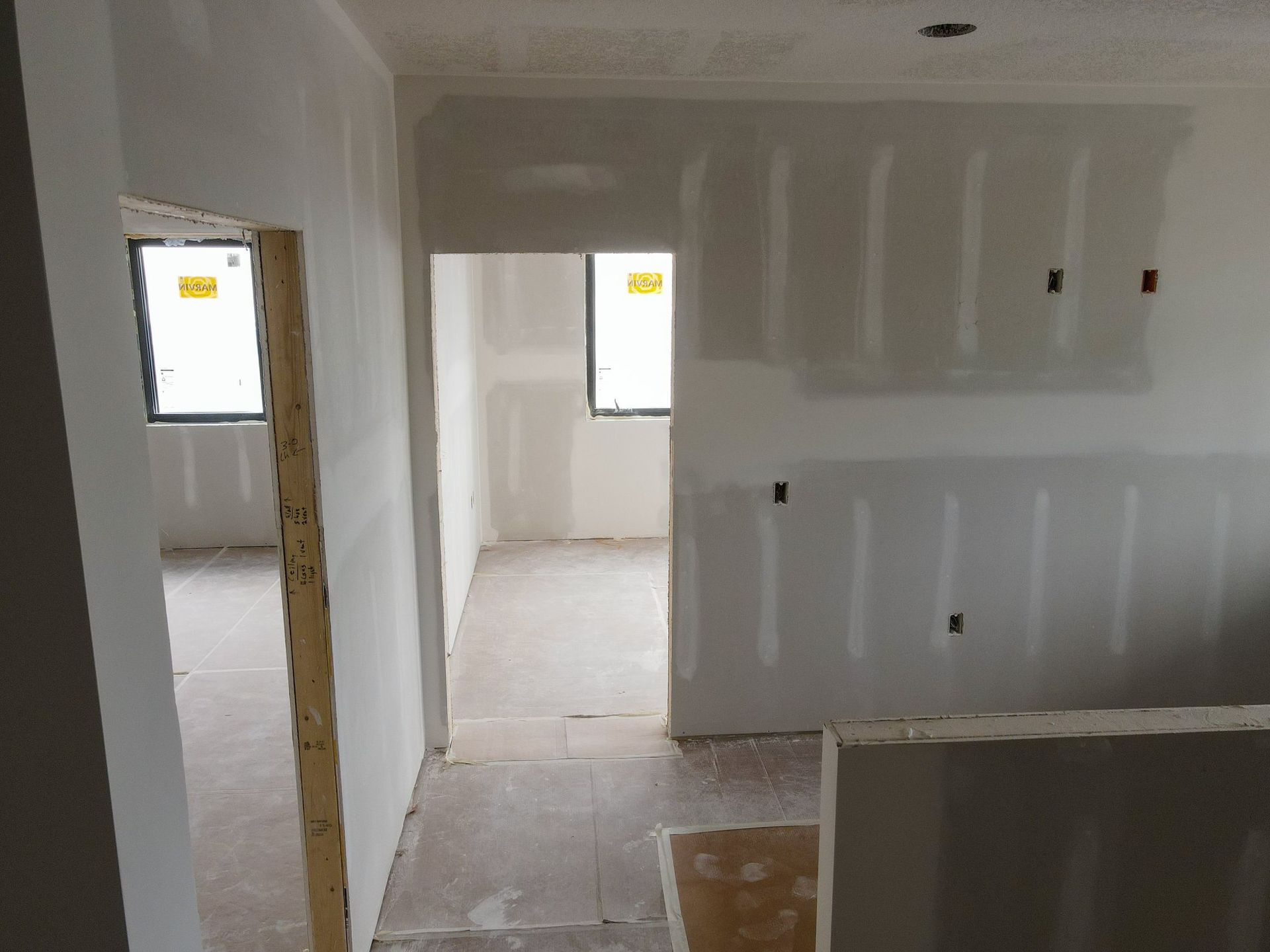 A room that is being remodeled with drywall on the walls