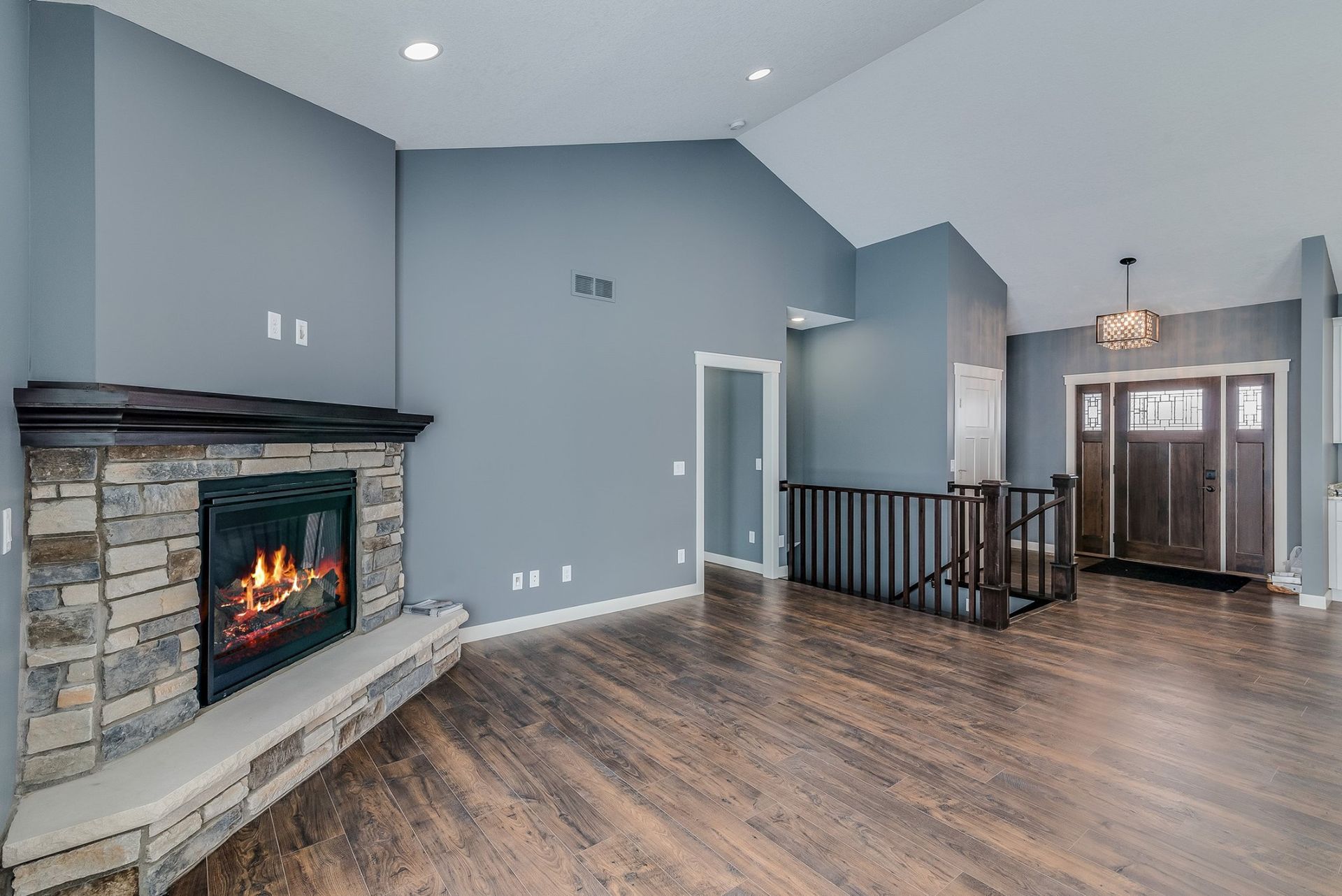 There is a fireplace in the middle of the living room.