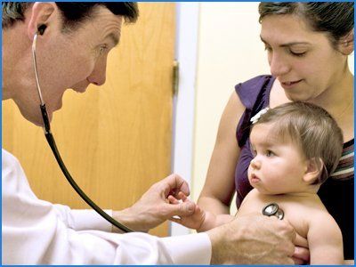 Doctor checking the baby