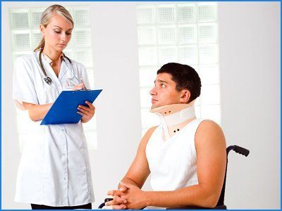 Lady doctor writing details of injured patient