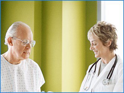 Lady doctor checking the old person