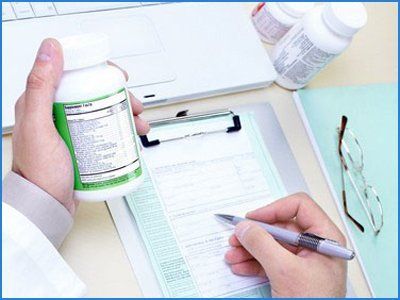 Doctor writing a medicine details