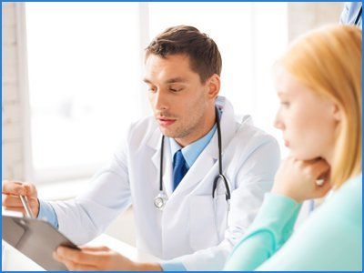 Doctor explaining a diet plan to lady