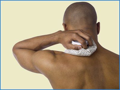 Person kept icepack on paining shoulder