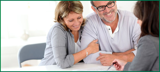Couple in discussion with an insurance agent