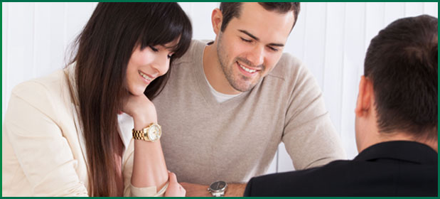 Couple in discussion with an insurance agent