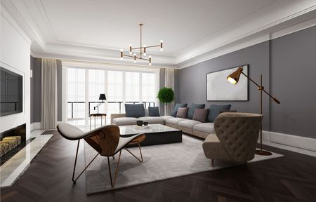 A living room with a couch , chair , coffee table and fireplace.
