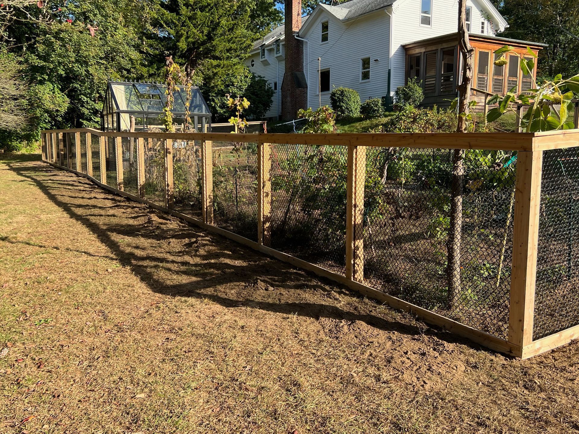 Custom garden fence with wood post and mini mesh chain link