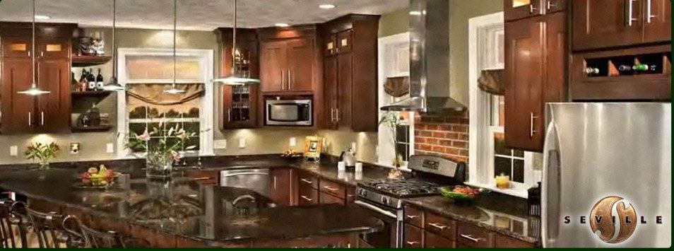 A kitchen with stainless steel appliances and wooden cabinets