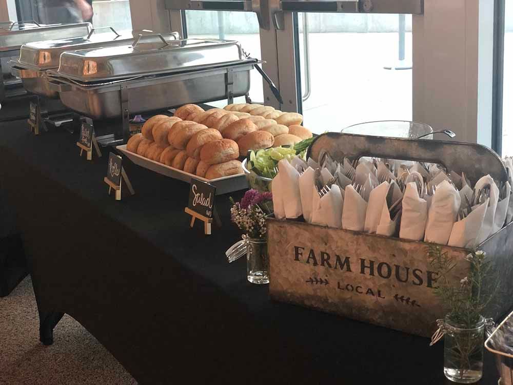 a buffet table with a box that says farm house on it