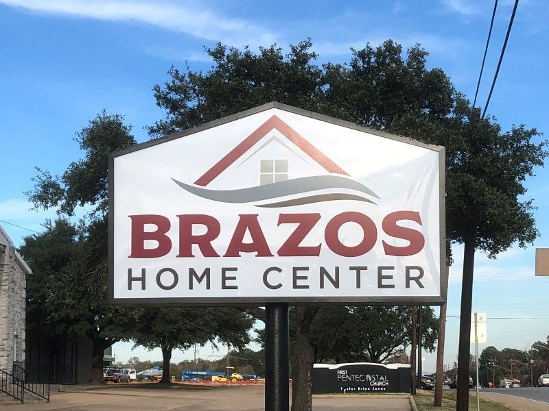 A sign that says brazos home center on it