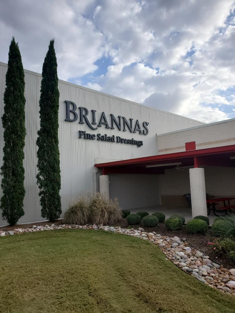 A white building with the word briannas on it