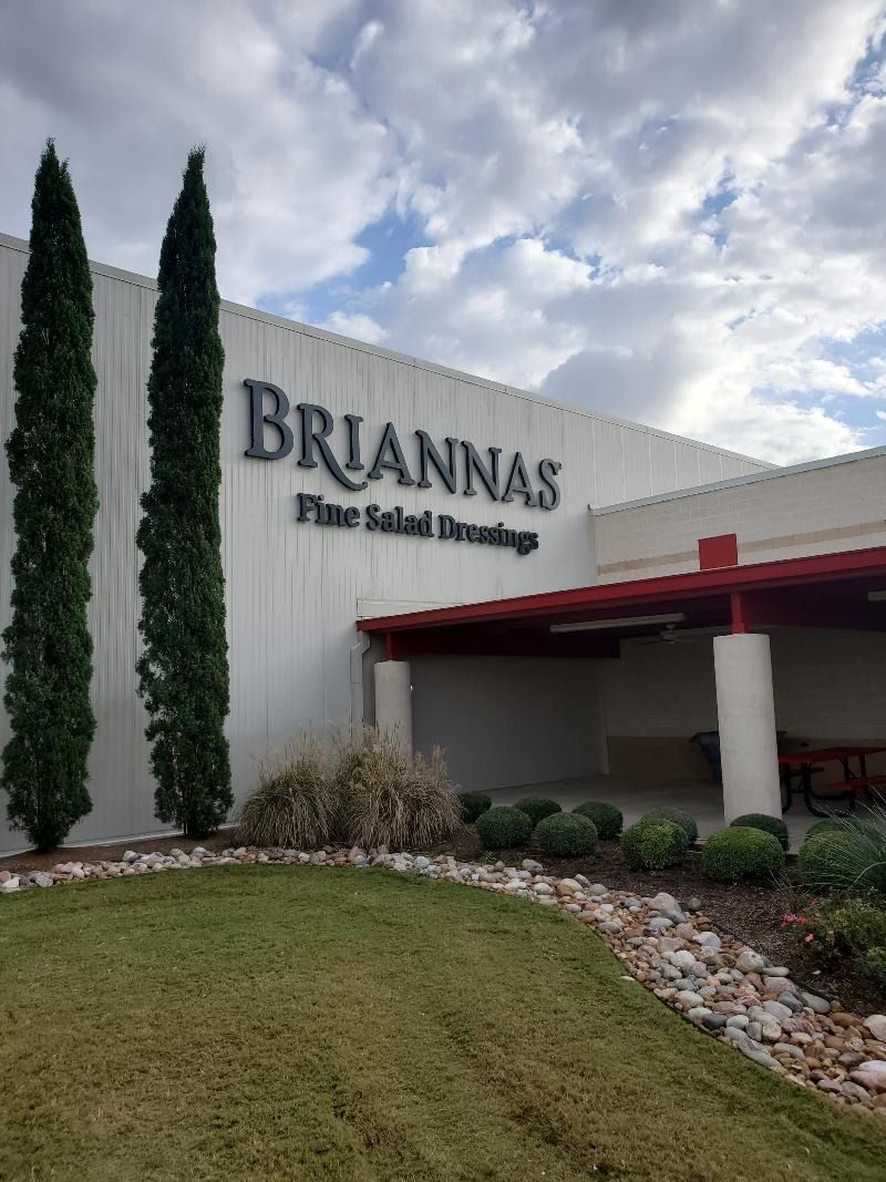 A large white building with the word briannas on it