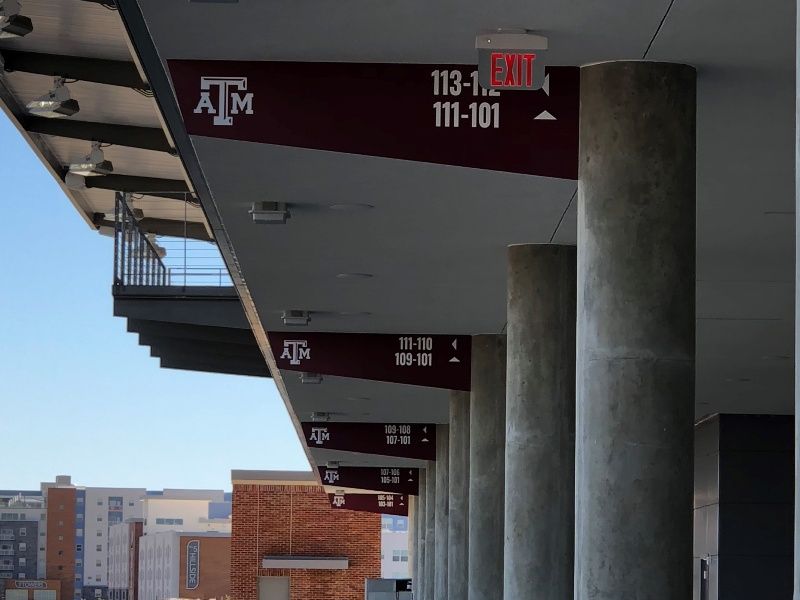 A sign on the roof of a building says atm 111-101