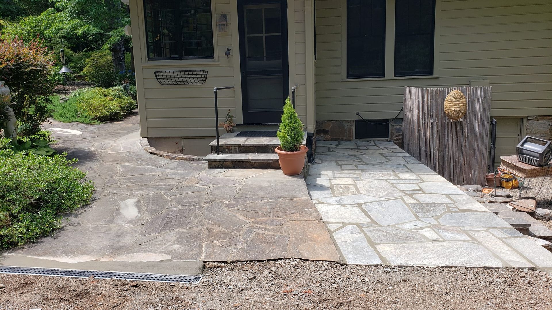 A house with a stone walkway leading to the front door
