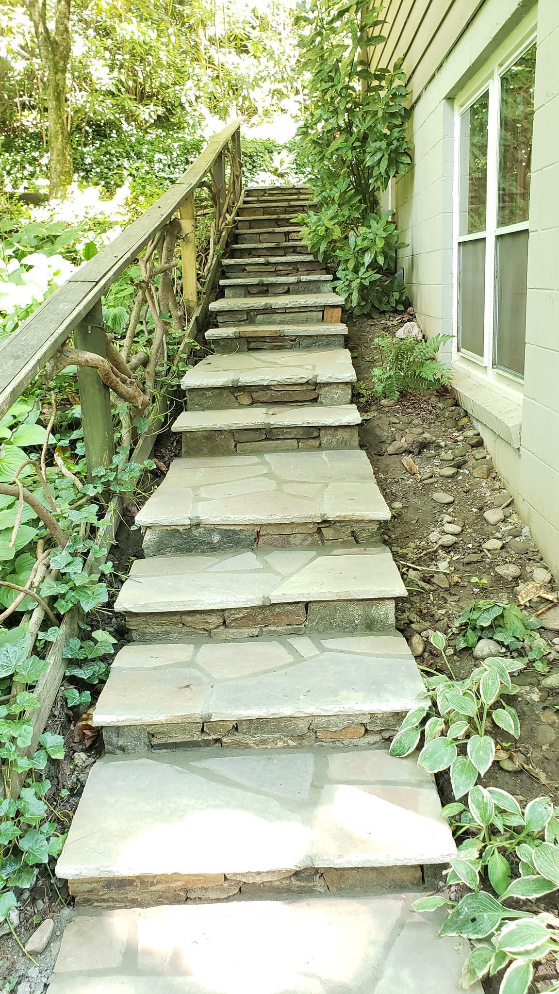 A set of stone stairs leading up to a house