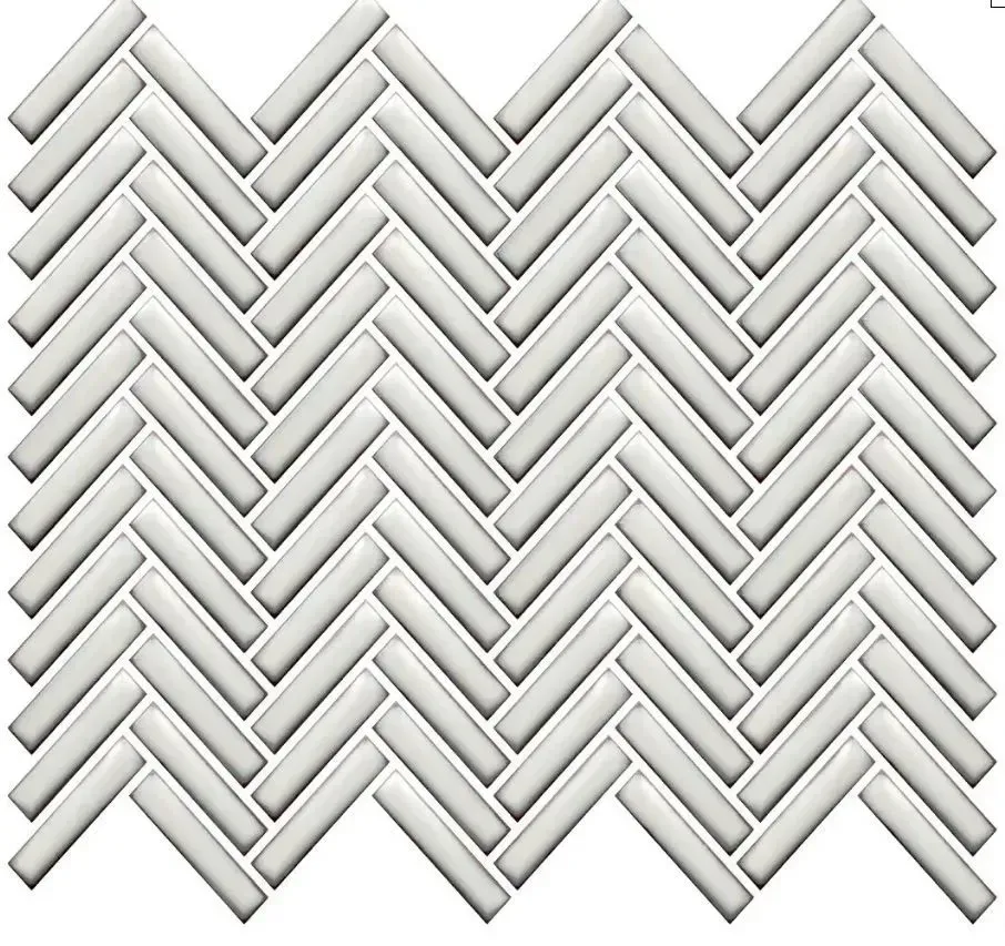 A pattern of light gray rectangular tiles arranged in a uniform, repeating herringbone layout.