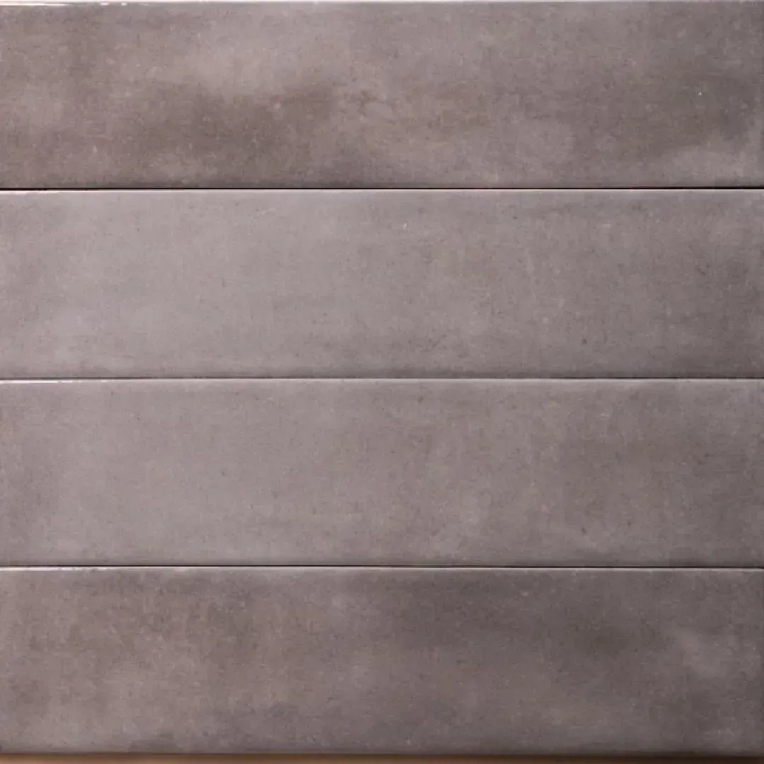 Four rectangular, matte gray tiles with subtle, mottled texture arranged horizontally in a stacked pattern.
