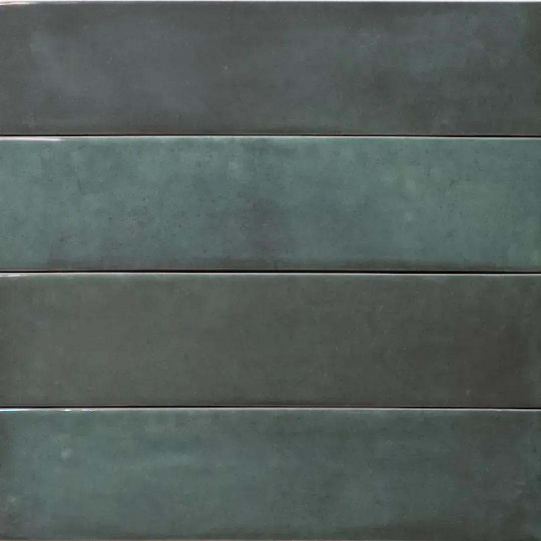 Four rectangular ceramic tiles stacked horizontally, featuring a variegated deep teal and dark green matte finish.