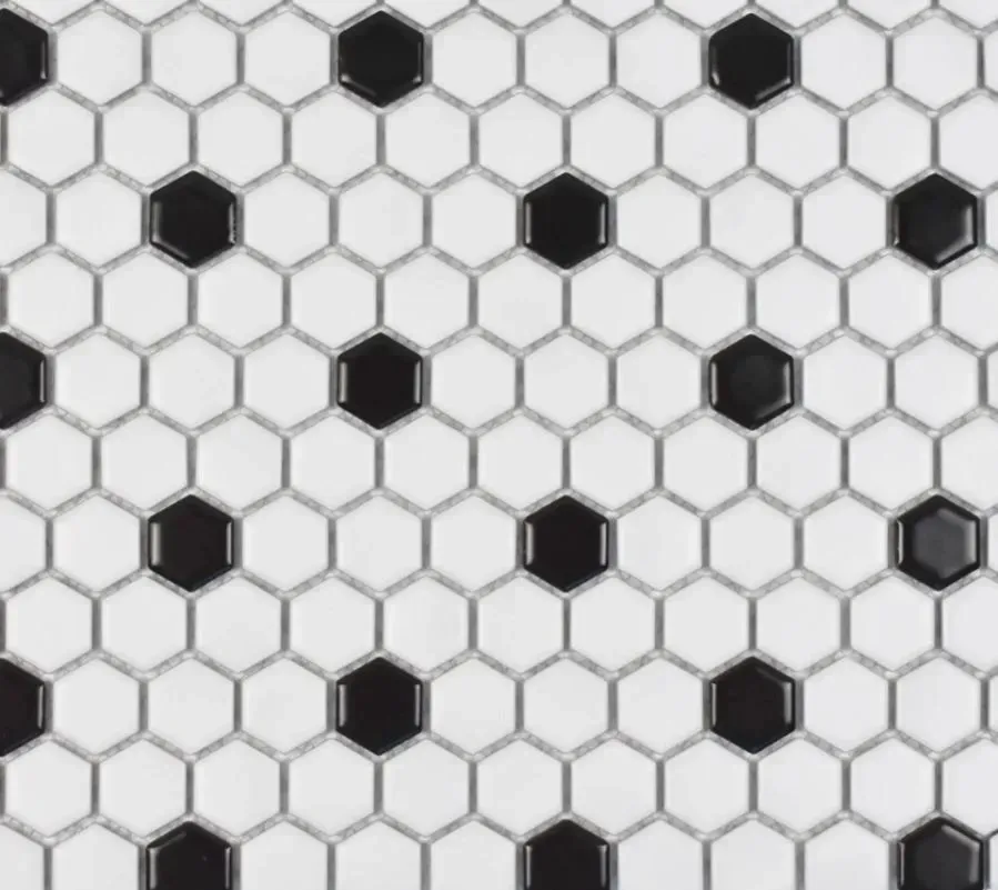 A repeating pattern of white hexagonal tiles with black hexagonal tiles spaced evenly throughout.