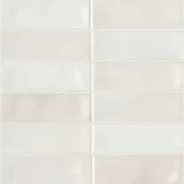 A grid of rectangular, glossy white and off-white ceramic tiles arranged in a stacked, uniform pattern.