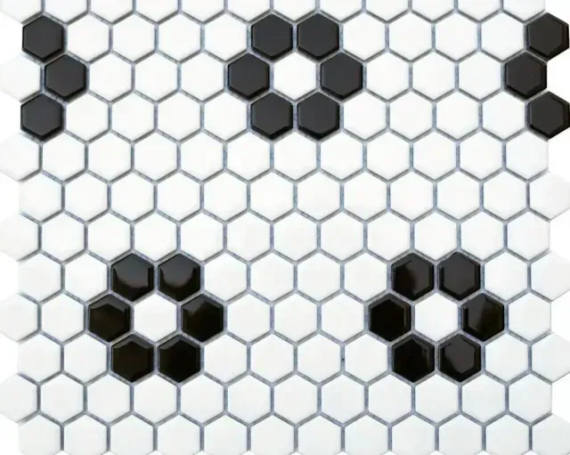 A white hexagonal tile pattern featuring small clusters of black tiles arranged in flower-like shapes.