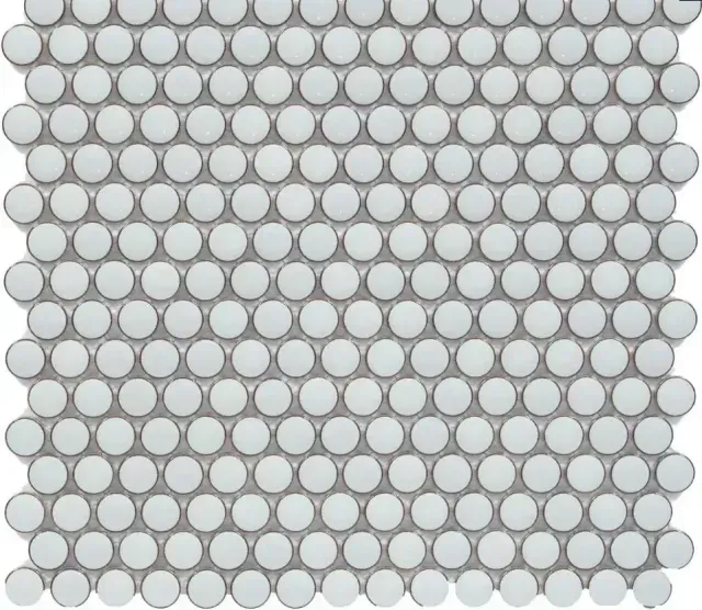 A grid of light grey, circular penny tiles with a matte finish.