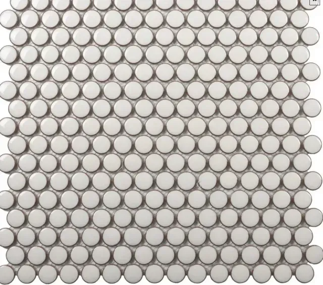 A white, glossy penny round mosaic tile sheet featuring a uniform, grid-like pattern of circular tiles.