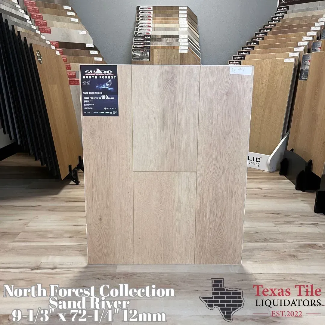 A laminate flooring sample from the North Forest Collection, Sand River, displayed at Texas Tile Liquidators.