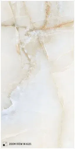 A slab of white onyx marble featuring soft, flowing grey and gold veining throughout the polished stone surface.