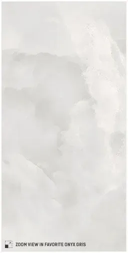 White onyx marble tile featuring soft, cloudy gray veining and a polished finish.