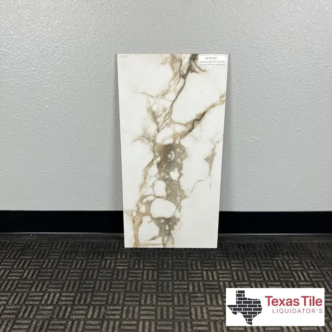 A rectangular porcelain tile with a white base and brown, marble-like veining patterns, displayed against a grey wall.