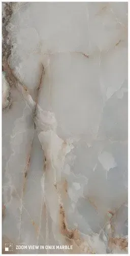 A polished stone surface featuring a white, translucent base with soft grey and subtle amber marble-like veins.