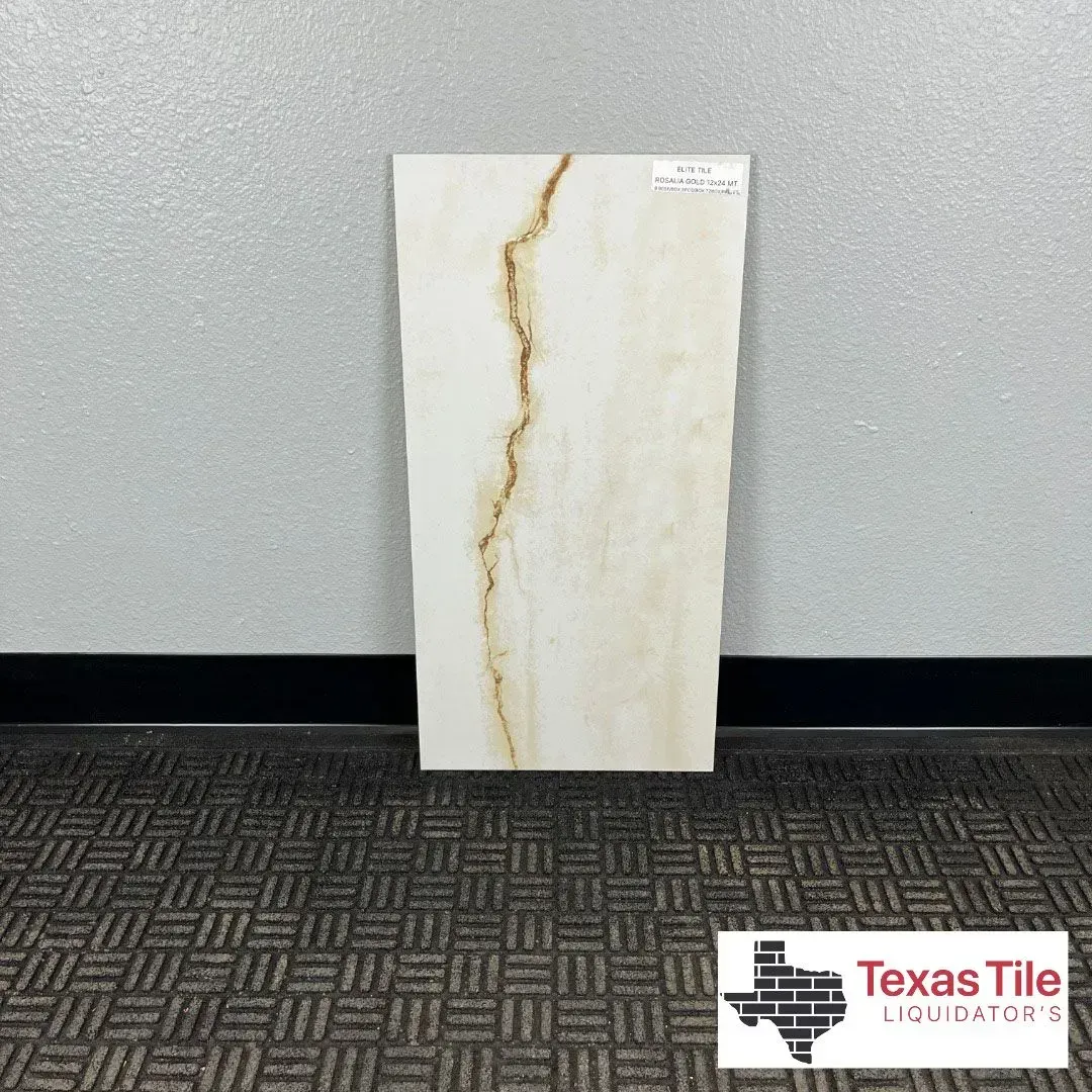 A rectangular cream-colored tile with a prominent brown vein, standing against a grey wall with a Texas Tile logo below.